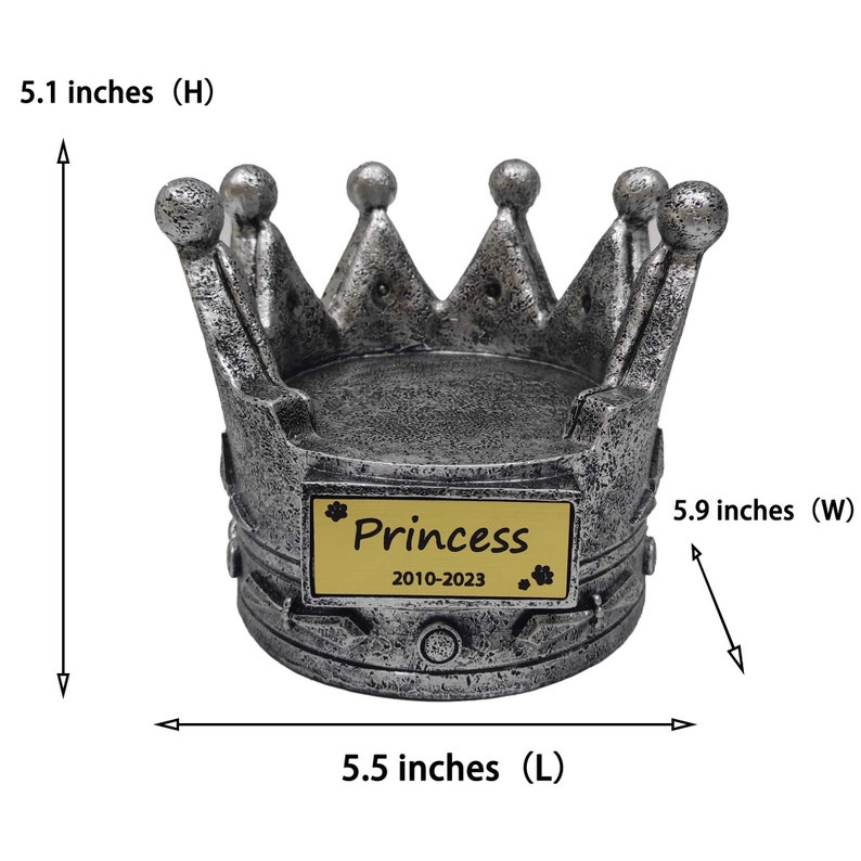May include: Silver crown shaped pet urn with a gold plaque that reads "Princess 2010-2023". The urn measures 5.1 inches in height, 5.5 inches in length, and 5.9 inches in width.