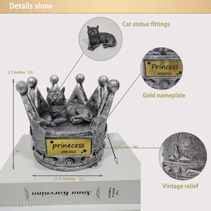 May include: Silver crown shaped pet urn with a cat figurine on top. The urn has a gold nameplate that reads "prinecess 2006-2022". The urn is 5.5 inches wide and 5.1 inches tall.