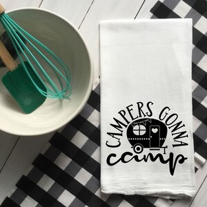 May include: White kitchen towel with a black camper silhouette and the text "Campers Gonna Camp".