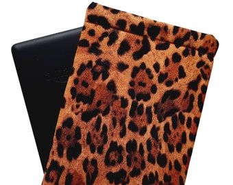May include: A black e-reader in a leopard print case. The case has a brown and black pattern.
