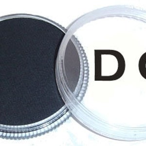 May include: A black paint pot with a silver lid and a clear plastic lid with the letters "DC" printed on it.