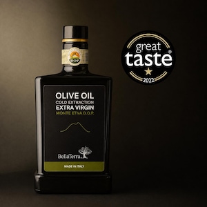 May include: A rectangular dark glass bottle of BellaTerra extra virgin olive oil with a black label featuring the text OLIVE OIL, COLD EXTRACTION, EXTRA VIRGIN, MONTE ETNA D.O.P., MADE IN ITALY, and a Great Taste 2022 award seal.