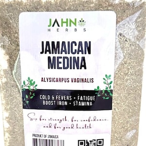May include: A clear plastic bag filled with dried herbs. The label reads "JAMAICAN MEDINA" with the text "COLD & FEVERS • FATIGUE • BOOST IRON • STAMINA". The product is from Jamaica.