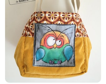 Yellow velvet bag with bird decoration