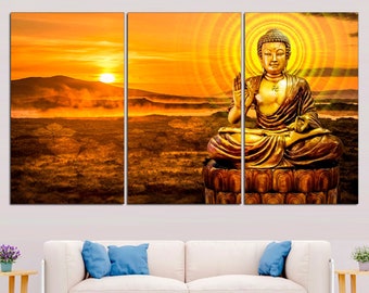 May include: A three-panel canvas print featuring a golden Buddha statue sitting in a meditative pose against a sunset backdrop. The statue is surrounded by a halo of light and sits on a platform with intricate carvings.