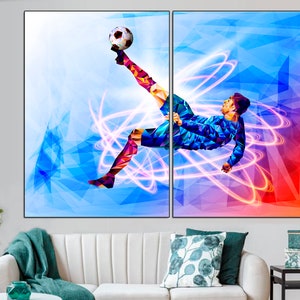 May include: A digital art print of a soccer player kicking a ball in mid-air. The player is surrounded by colorful geometric shapes and glowing light trails. The background is a mix of blue, red, and purple.