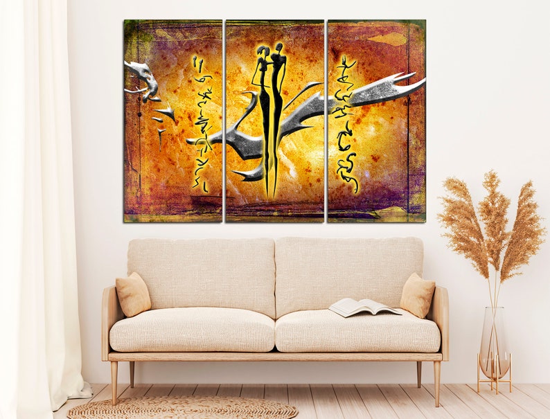 May include: A three-panel abstract art print with a yellow, orange, and brown background. The print features two stylized figures in black and white, standing together. The figures are surrounded by abstract lines and shapes in yellow and white.
