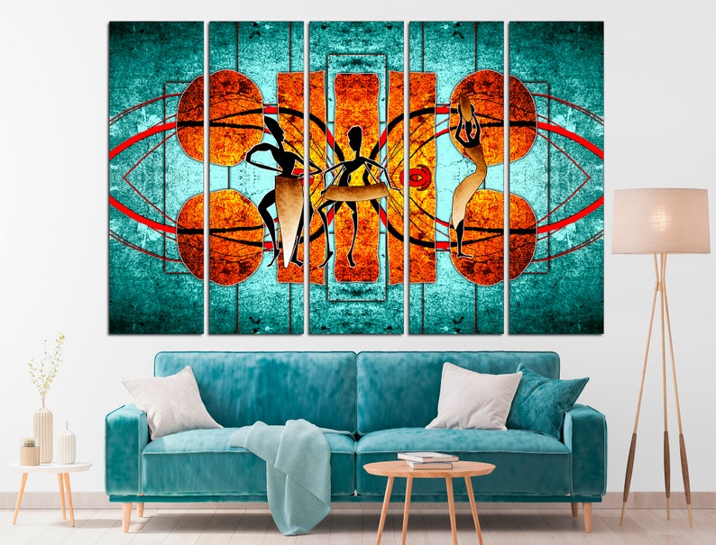 May include: A multi-panel canvas print featuring an abstract design with stylized figures in orange, yellow, and black against a turquoise background. The design includes geometric shapes and lines.