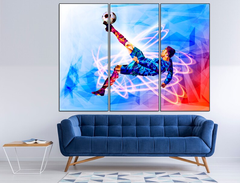 May include: A colorful abstract painting of a soccer player kicking a ball. The player is in mid-air, with their leg extended and their foot about to make contact with the ball. The background is a mix of blue, red, and white, with geometric shapes and lines.