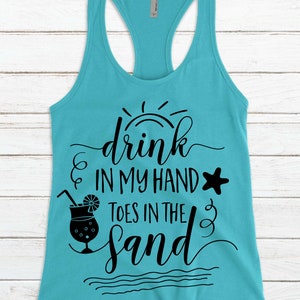 May include: A turquoise tank top with a black graphic that says "drink in my hand toes in the sand" with a sun, a cocktail glass, and a starfish.