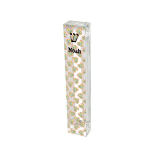 May include: A clear acrylic mezuzah case with a rainbow heart pattern and the name "Noah" printed on the front. The mezuzah case has a Star of David on the top.