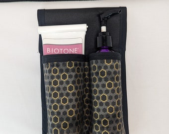 Hexágono en negro, gris y oro metálico Loción doble para terapeuta de masaje y funda utilitaria
