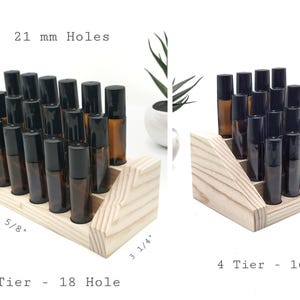 May include: Wooden essential oil display stands with amber glass bottles and black caps. The 3-tier stand holds 18 bottles and measures 8 5/8" long and 3 1/4" wide. The 4-tier stand holds 16 bottles. The holes are 21 mm.