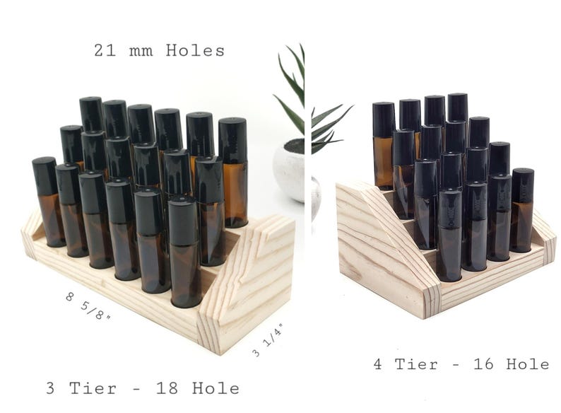 May include: Wooden essential oil display stands with amber glass bottles and black caps. The 3-tier stand holds 18 bottles and measures 8 5/8" long and 3 1/4" wide. The 4-tier stand holds 16 bottles. The holes are 21 mm.