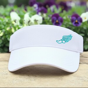 May include: White visor with a curved brim and a mesh top. A teal-colored running shoe with wings is embroidered on the side. The visor is designed for sun protection during outdoor activities.