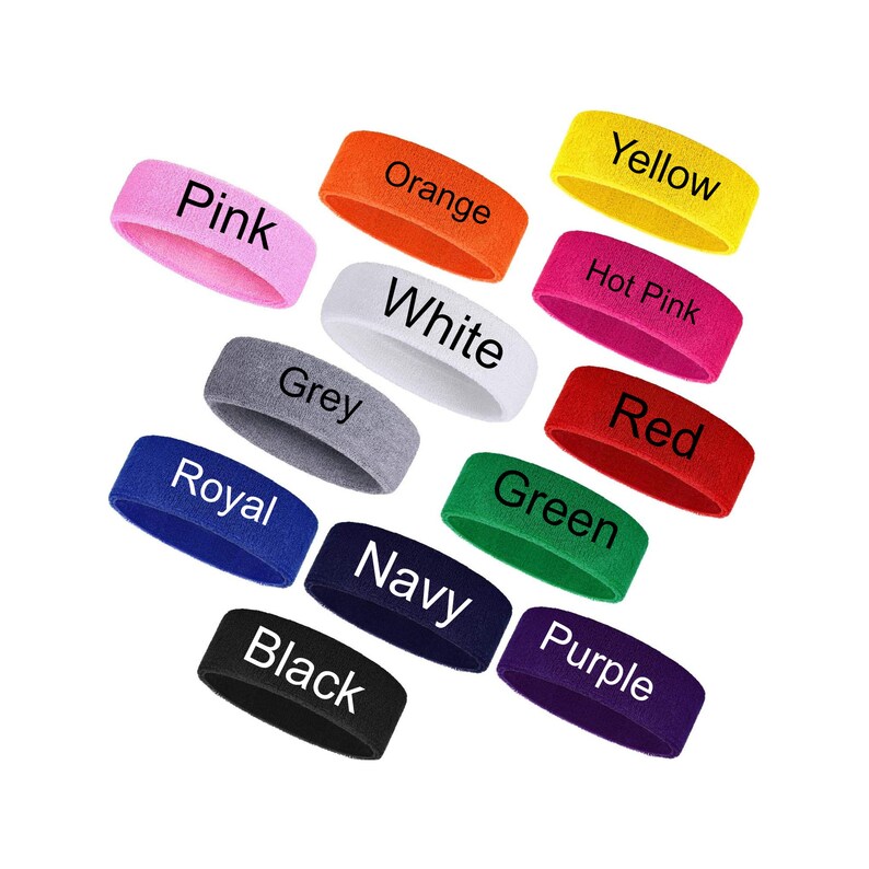 May include: A selection of colourful headbands in shades such as pink, orange, yellow, hot pink, red, green, purple, navy, black, royal blue, grey, and white. Each headband has its colour name printed on it.