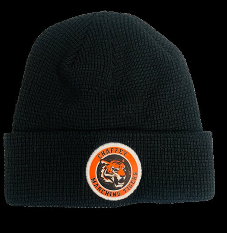 May include: Black knit beanie with a white and orange circular patch that says "Chaffey Marching Tigers".