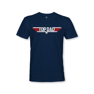 May include: A navy blue t-shirt with a white and red graphic that says "TOP DAD" with a star.
