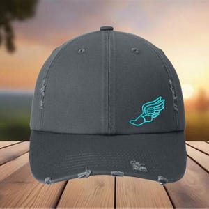 May include: A dark gray distressed baseball cap with a turquoise blue running shoe logo on the front.