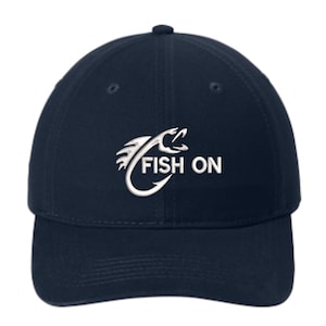 May include: Navy blue baseball cap with the words "FISH ON" in white, along with a white graphic of a fish and hook. The cap has a curved brim and a button on top.
