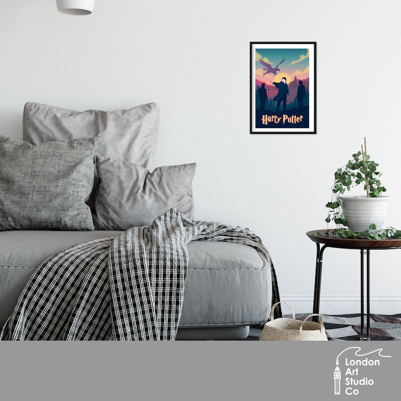 May include: A vintage-style poster with a silhouette of Harry Potter and two other characters standing in front of a castle with a phoenix flying overhead. The poster has a blue, pink, and orange color scheme and the text "Harry Potter" at the bottom.