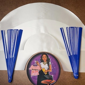 May include: Three white satin fabric fan bases with blue and white plastic fan sticks. The fan sticks are folded and ready to be opened. The fan bases are arranged in a circle with the fan sticks extending out from the center.