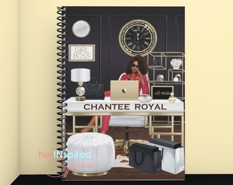 May include: A spiral-bound notebook featuring a stylish illustration of a woman at a desk. The desk has a laptop, coffee cup, and the name "CHANTEE ROYAL". The background includes a clock, a "GIRL BOSS" sign, and a shelf with accessories. The notebook has a black cover.