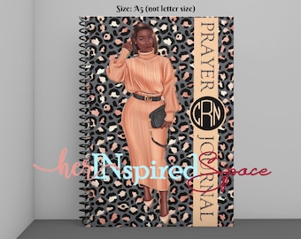 May include: A spiral-bound journal with a leopard print background and the words "PRAYER JOURNAL". The cover features an illustration of a woman in a peach-colored dress. The journal is A5 size.