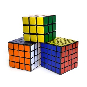 May include: Three Rubik's Cubes, one yellow and green, one orange and white, and one blue and red.