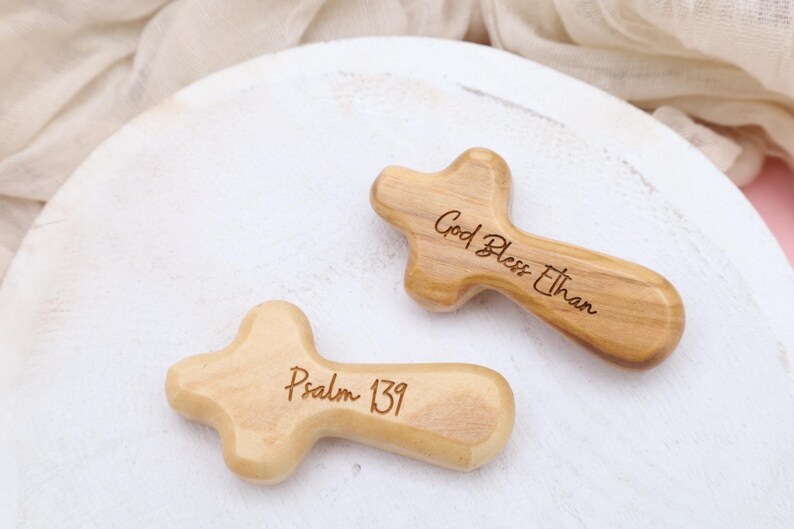 May include: Two wooden crosses with engraved text. One cross reads "God Bless Ethan" and the other reads "Psalm 139".