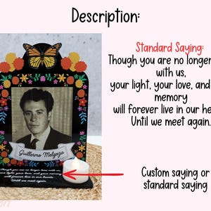 May include: A black memorial plaque featuring a monarch butterfly, colorful floral accents, and a central photograph of a man. A white banner displays the name Guillermo Melgoza, and the base includes the text: Though you are no longer here with us, your light, your love, and your memory will forever live in our hearts. Until we meet again. A small white tea light candle sits on the base.