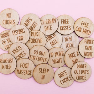 May include: Wooden tokens with various phrases written on them, such as "No Chores", "Free Kisses", "Breakfast in Bed", and "Family Game Night".