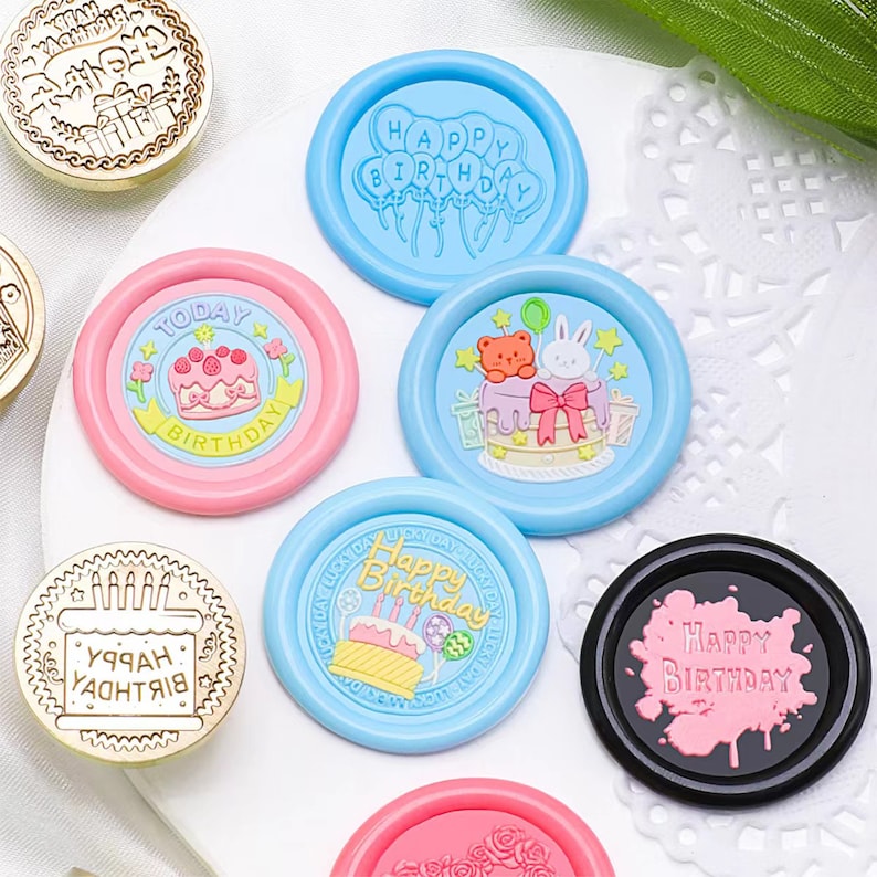 May include: Assortment of colorful wax seals with birthday themes.  The seals feature a variety of designs including balloons, cakes, and animals.  The text on the seals includes "Happy Birthday", "Today Birthday", and "УРАА YACHTRIA".
