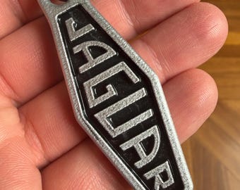 2.6" Vintage Aluminum Jaguar Keychain Black background with Scotch-Brite Finish