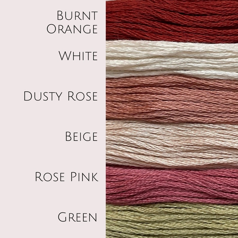May include: Six spools of embroidery floss in different colors: burnt orange, white, dusty rose, beige, rose pink, and green.