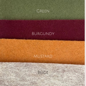 May include: Four fabric swatches in different colors: green, burgundy, mustard, and beige.