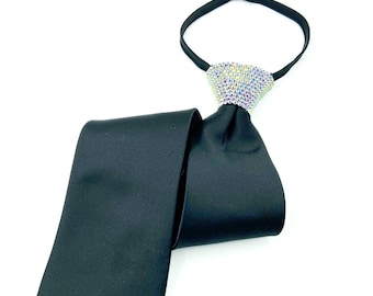 May include: A black satin tie with a large, clear rhinestone embellishment at the knot.