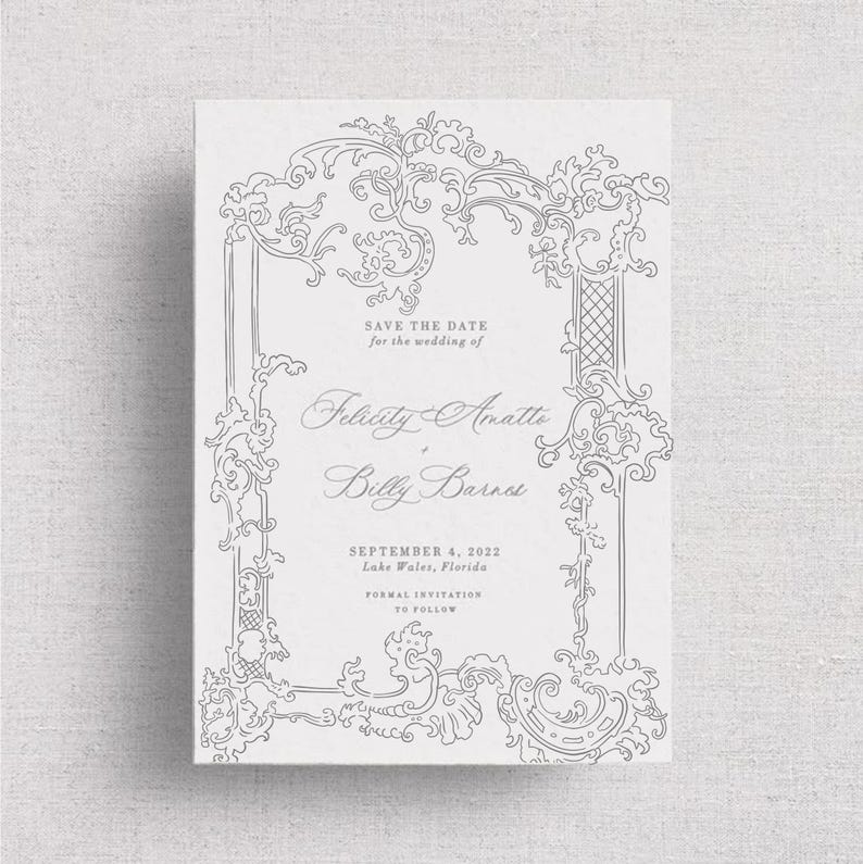 May include: A formal wedding invitation with ornate gray scrollwork framing the text. The invitation reads "Save the Date" and includes the names Felicity Amatte and Billy Barnes, along with the wedding date and location.