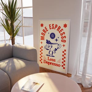 May include: A framed poster with a retro coffee theme. The poster features a cartoon coffee cup character with the text "More Espresso, Less Depresso" in red and blue. The poster is displayed in a living room setting.