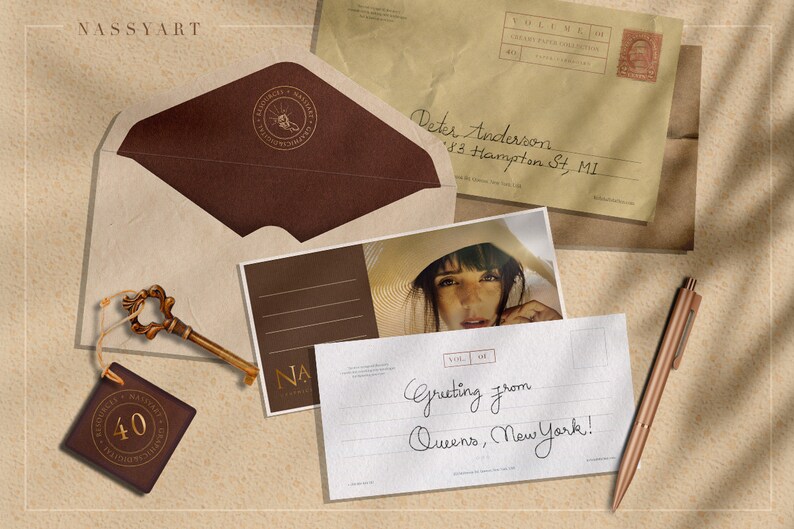 May include: A vintage postcard with a handwritten message that reads "Greeting from Queens, New York!" The postcard is sitting on a brown surface with a key, a brown envelope, and a pen.