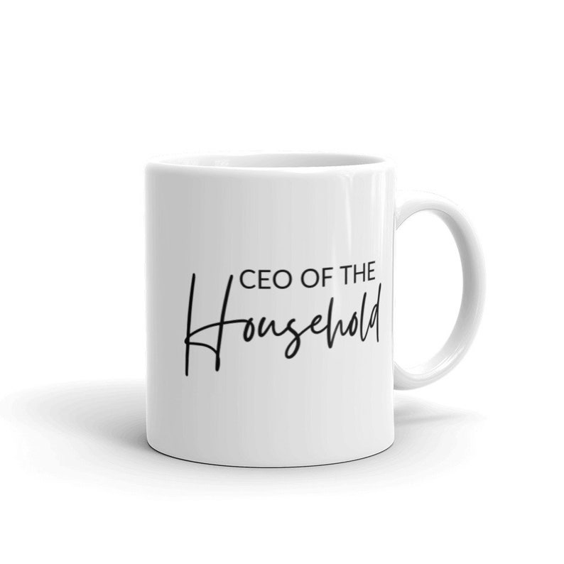 May include: White ceramic coffee mug with black text that reads "CEO of the Household".
