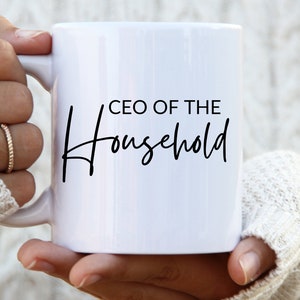 May include: White ceramic mug with black text that reads "CEO of the Household" in a cursive font.