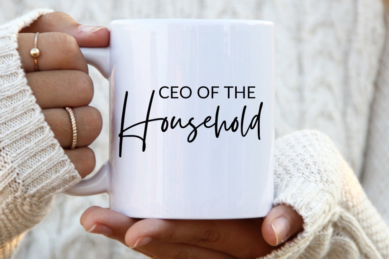 May include: White ceramic mug with black text that reads "CEO of the Household" in a cursive font.