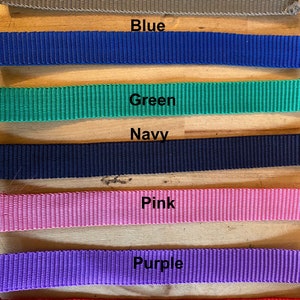 May include: A close-up of seven fabric straps in different colors: grey, blue, green, navy, pink, purple, and red. The text "Kits can also be made in the below colours" is at the top of the image.