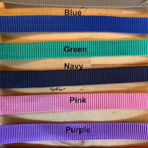 May include: A close-up of seven fabric straps in different colors: grey, blue, green, navy, pink, purple, and red. The text "Kits can also be made in the below colours" is at the top of the image.