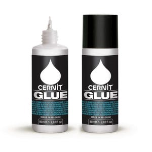 May include: Two bottles of Cernit Glue, a polymer clay adhesive. One bottle has a pointed applicator, the other a black cap. Both bottles have a black label with white text and a white teardrop design. Each bottle contains 2.82 fl oz.