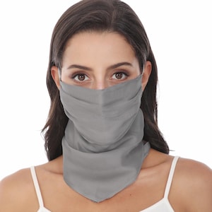 May include: A solid grey face covering that extends down to the neck, featuring a pleated design across the nose and mouth area. The fabric is smooth and opaque, providing full coverage from the bridge of the nose to the base of the throat.