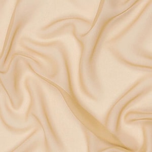 May include: A solid light beige fabric with a smooth, semi-sheer texture. The material is draped in soft, flowing folds that create subtle shadows and highlights across the surface, emphasising the delicate and lightweight nature of the textile.