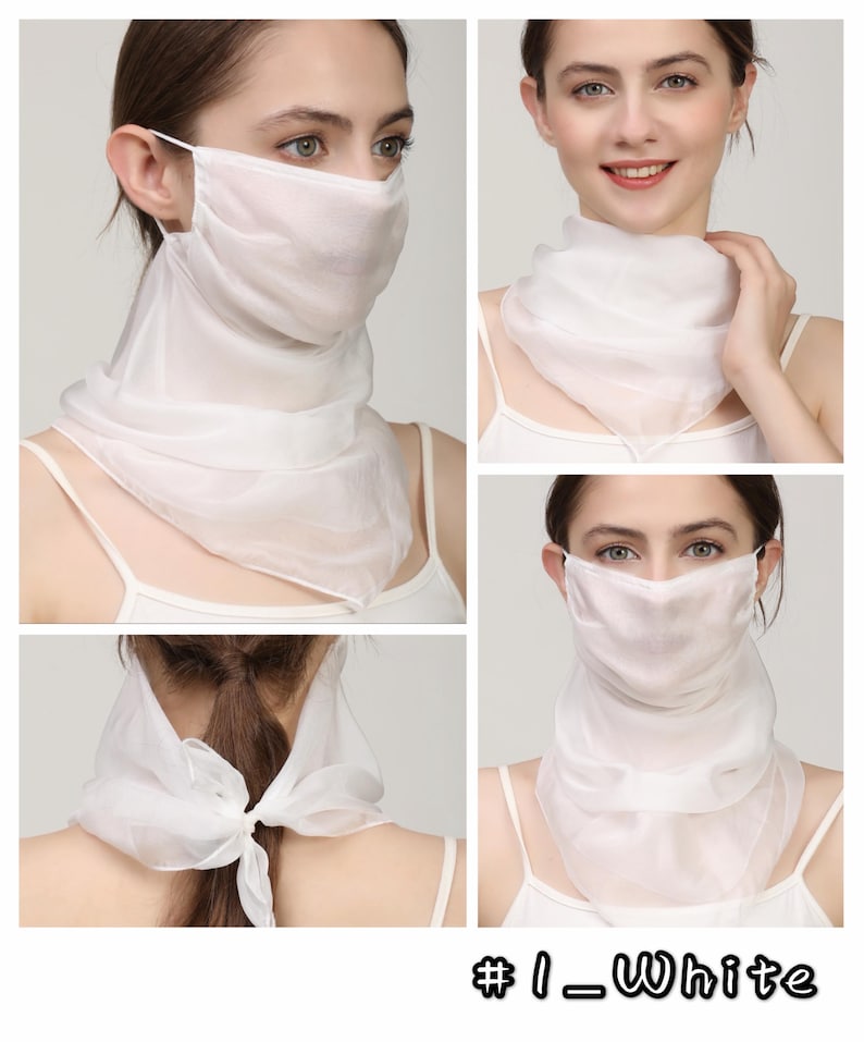 May include: A white, semi-sheer fabric face covering that extends into a scarf, featuring ear loops for secure placement and a tie closure at the back of the neck. The accessory is labelled #1_White and provides coverage for the nose, mouth, and neck.