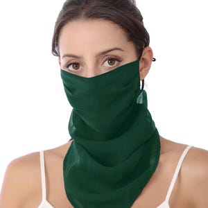 May include: A dark green face covering made of a lightweight, semi-sheer fabric. The accessory features a draped, scarf-like design that covers the nose and mouth, extending down to the neck and chest area with soft, flowing folds of material.